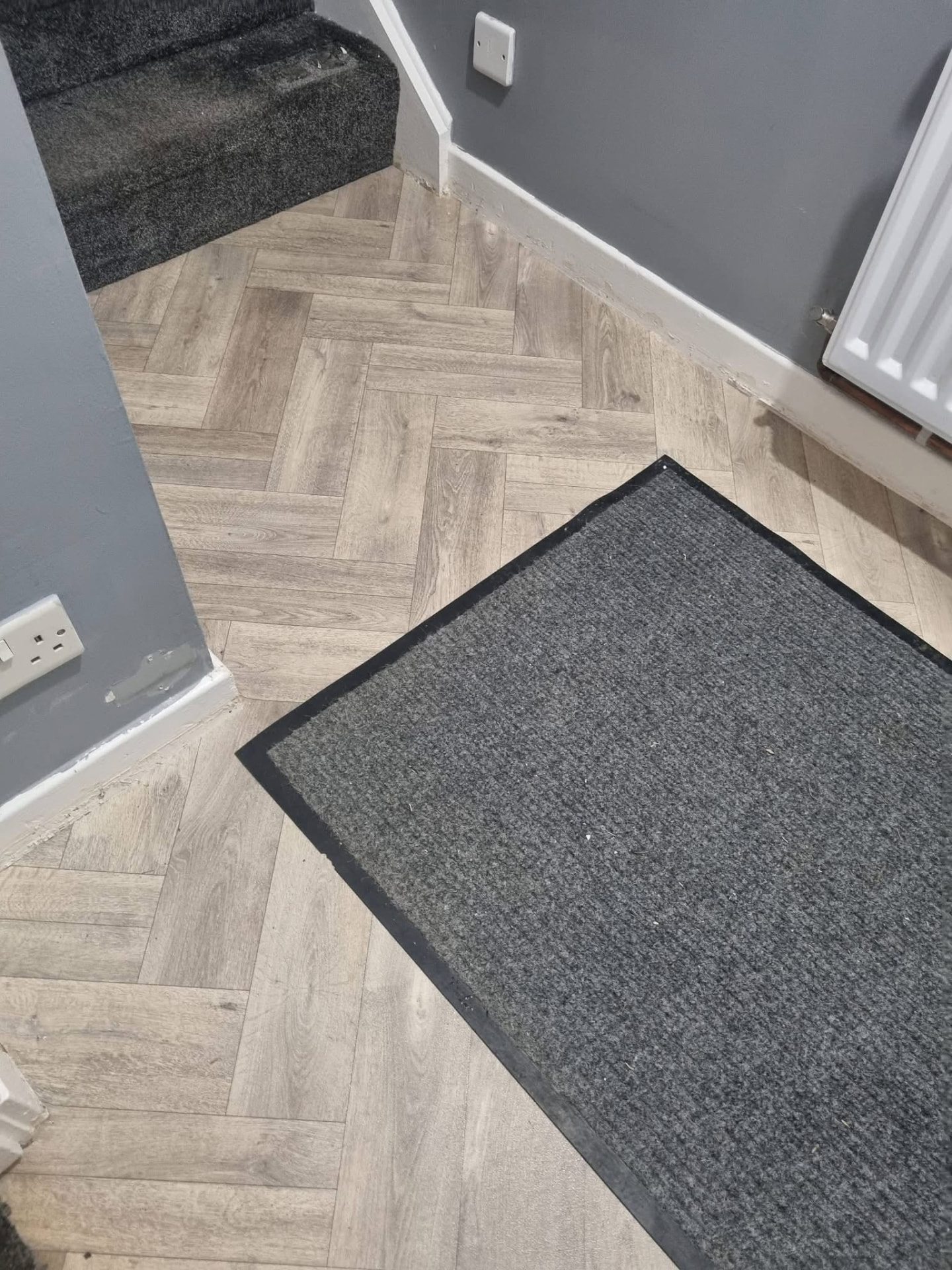 Herringbone flooring fitted in a Dumfries hallway